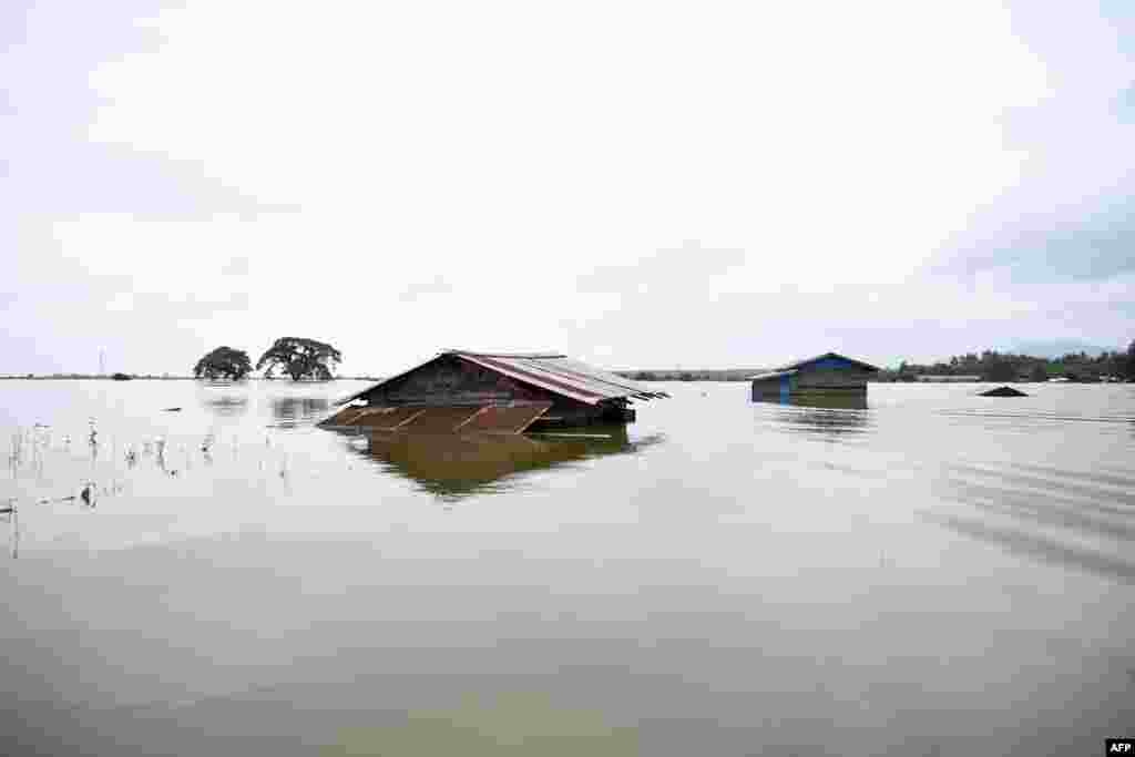 Houses submerged in floodwaters are seen in Shwegyin township, Bago Region, Myanmar. Raging monsoon flooding across the country has forced tens of thousands of people from their homes in recent weeks, officials said.