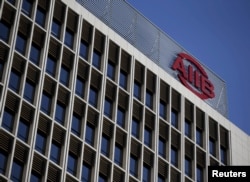 FILE - The logo of Asian Infrastructure Investment Bank (AIIB) is seen at its headquarter building in Beijing, Jan. 17, 2016.