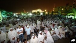 FILE - Kuwaiti citizens gather at al-Irada Square, Kuwait City, to protest against government corruption and demand transparency in government, June 10, 2014.