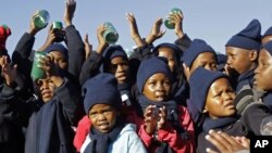 Children sing 'Happy Birthday' in honor of former South African President Nelson Mandela during celebrations for Mandela's birthday in Mvezo, South Africa, July 18, 2012.