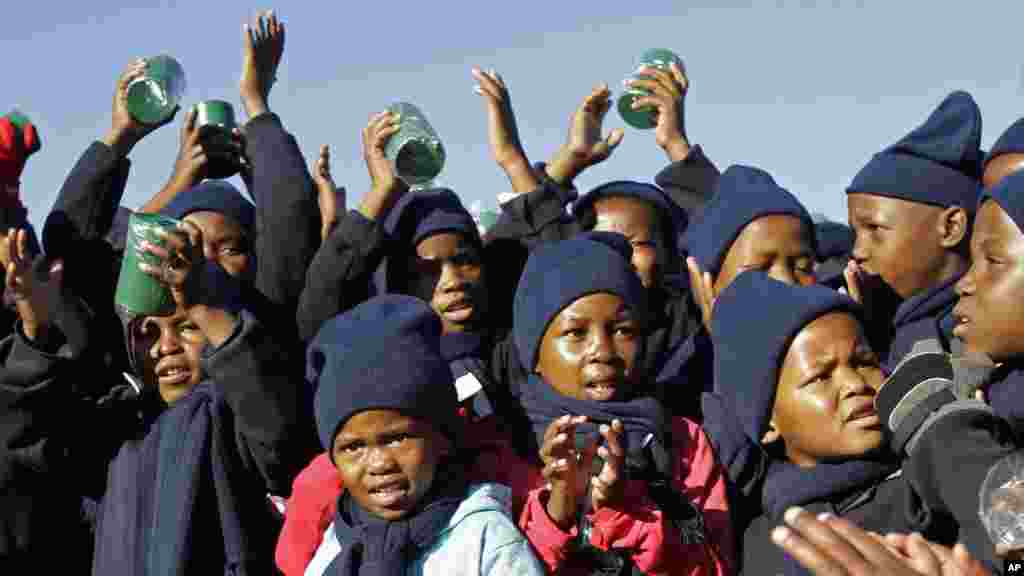 Children sing happy birthday in honor of former South African president Nelson Mandela during celebrations for Mandela&#39;s birthday in Mvezo, South Africa, July 18, 2012.