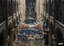 An interior view of the Notre-Dame Cathedral in Paris in the aftermath of a fire that devastated the cathedral, April 16, 2019.