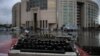 FILE - A broken typewriter is symbolicaLly displayed outside Istanbul's courthouse during a retrial of a journalist and press freedom activist on charges of supporting Kurdish militants, in Istanbul, Turkey, Sept. 30, 2021.