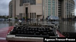 FILE - A broken typewriter is symbolically displayed outside Istanbul's courthouse during the trial of a journalist on charges of supporting Kurdish militants, Sept. 30, 2021. At least six Kurdish journalists have been detained in Turkey so far in January 2025.