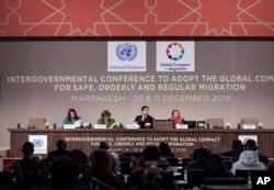 From left, Maria Fernanda Espinosa, President of the United Nations General Assembly, Special Representative of the United Nations Secretary-General for International Migration Louise Arbour, Moroccan Minister of Foreign Affairs and International Cooperation, Nasser Bourita, speak during the closing session of U.N. Migration Conference in Marrakech, Morocco, Dec. 11, 2018.