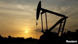 FILE - An oil pump is seen in Lagunillas, Ciudad Ojeda, in the state of Zulia, Venezuela, March 2015.