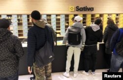 People look to purchase cannabis products at the Quebec Cannabis Society (SQDC) store, on the day Canada legalizes recreational marijuana, in Montreal, Quebec, Canada, Oct. 17, 2018.