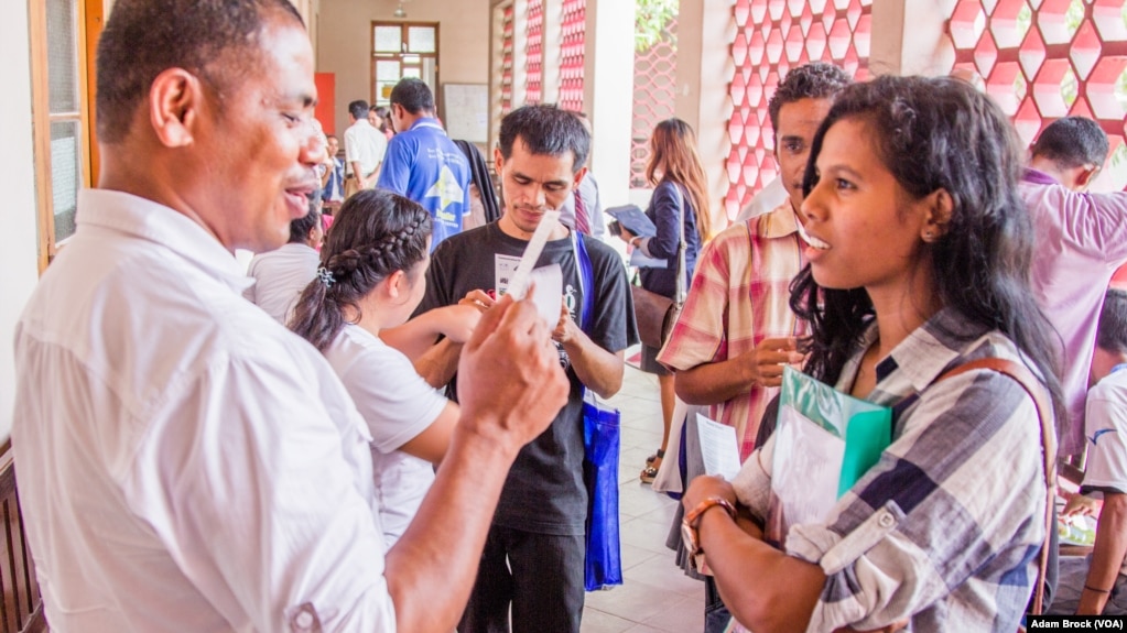 Teachers in trainings at the National University of East Timor practice an interactive English game.