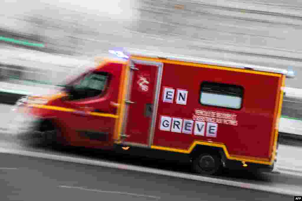 A firemen truck reading &quot;on strike&quot; runs in Nantes, France.