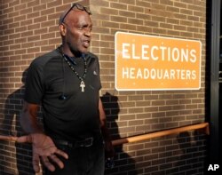Former felon Robert Eckford talks with reporters after registering to vote at the Supervisor of Elections office Jan. 8, 2019, in Orlando, Fla.