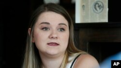 Danyelle Dyer talks during an interview in Edmond, Oklahoma, Aug. 9, 2017. Dyer had to obtain a court order after the man who molested her when she was 7 years old moved in next door. 