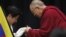 Tibetan spiritual leader the Dalai Lama gives a Tibetan shawl to Japan's main opposition Liberal Democratic Party president Shinzo Abe, at the upper house members' office building in Tokyo, November 13, 2012.