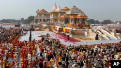 A general view of the audience during the opening of a temple dedicated to Hindu deity Lord Ram, in Ayodhya, India, Monday, January 22, 2024. (AP Photo/Rajesh Kumar Singh)