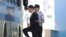 Samsung Electronics Co. Vice Chairman Lee Jae-yong, left, prepares to get on a vehicle as he leaves after his verdict trial at the Seoul Central District Court, Aug. 25, 2017 in Seoul. 