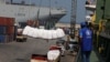 FILE - Humanitarian aid donated by World Food Program is unloaded at Beirut's port, in Beirut, Lebanon, Sept. 3, 2020. 