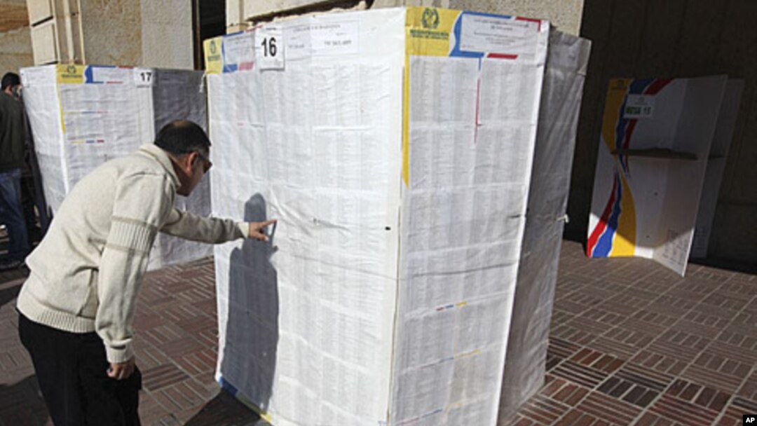 A voter searches for his name in an electoral list at a voting station in Bogota (file photo)