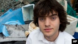 Dutch university dropout Boyan Slat, who founded the The Ocean Cleanup, poses for a portrait next to a pile of plastic garbage prior to a press presentation in Utrecht, Netherlands, May 11, 2017. 