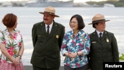 FILE - Taiwan's President Tsai Ing-wen, third from left, while en route to Pacific island allies, stands with delegates and National Park Service members at the USS Arizona Memorial at Pearl Harbor near Honolulu, Hawaii, Oct. 28, 2017.