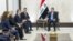 In this photo released by the Iraqi Prime Minister's Media Office, Prime Minister Mohammed Shia al-Sudani, right, meets with U.S. Secretary of State Antony Blinken, third from left, in Baghdad on Dec. 13, 2024.