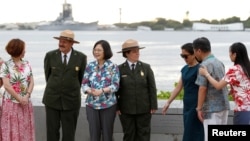 Taiwan's President Tsai Ing-wen, third from left, while en route to Pacific island allies, stands with delegates and National Park Service members at the USS Arizona Memorial at Pearl Harbor near Honolulu, Hawaii, Oct. 28, 2017.