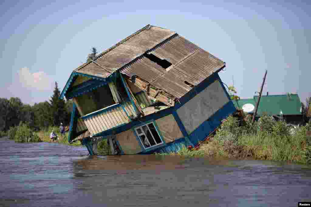 Destroyed house is seen in a flood-affected town of Tulun in Irkutsk Region, Russia.