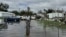 Carter Caldwell, 69, bikes through his family's flooded property just south of Houma, Louisiana after Hurricane Francine passed through the area, Sept. 12, 2024. 