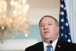 FILE - Secretary of State Mike Pompeo speaks to the media at the State Department, Nov. 24, 2020.