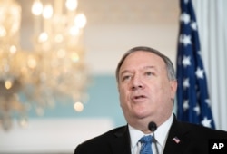 FILE - Secretary of State Mike Pompeo speaks to the media at the State Department, Nov. 24, 2020.