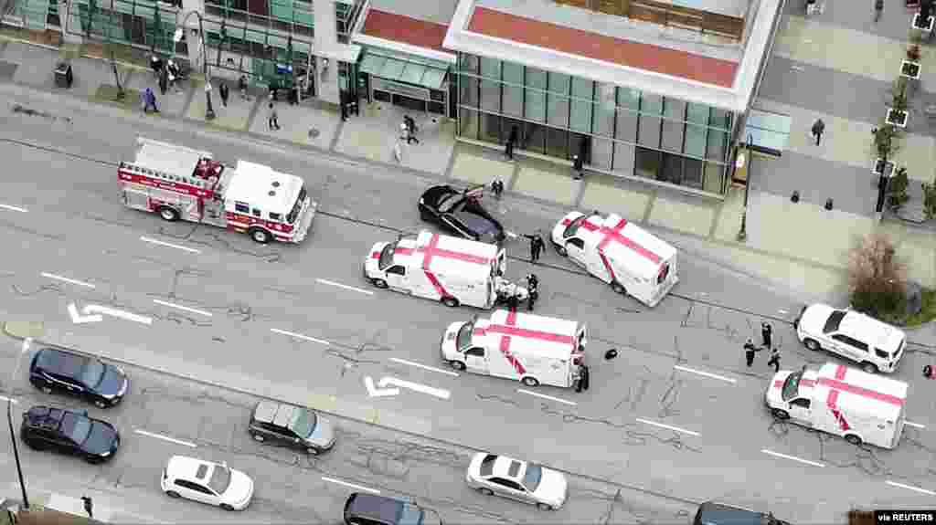 Ambulances and emergency personnel are seen outside Lynn Valley Main Library, where multiple people were stabbed by a suspect in North Vancouver, Canada, March 27, 2021, in this still image. (Andrew Cocking/SR MEDIA CANADA)