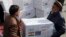 FILE- Afghan health ministry workers unloads boxes of the first shipment of 500K doses of the AstraZeneca coronavirus vaccine made by Serum Institute of India, donated by the Indian government in Afghanistan, Feb. 7, 2021. India has delivered two tons of medicines to Afghanistan.