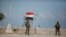 Palestinian members of security forces loyal to Hamas stand guard on the border between Egypt and southern Gaza Strip July 5, 2013. Egyptian security forces closed the Rafah border crossing and state media said it would reopen on Saturday. Security source