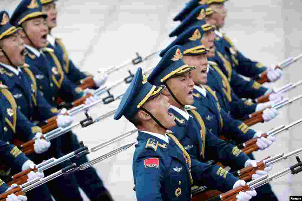 Members of the honor guard march during a welcoming ceremony at the Great Hall of the People in Beijing, China.