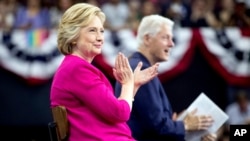 Democratic presidential candidate Hillary Clinton and former President Bill Clinton arrive for a rally at McGonigle Hall at Temple University in Philadelphia, July 29, 2016. (AP)