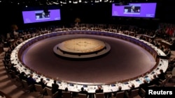 FILE - Screens overhead display U.S. President Barack Obama as he speaks at the closing session of the last Nuclear Security Summit in The Hague, March 25, 2014.