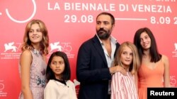 Director Saverio Costanzo and Elisa Del Genio, Margherita Mazzucco, Ludovica Nasti and Gaia Girace attend a photo call for "My Brilliant Friend" at the Venice Film Festival, Venice, Italy, Sept. 2, 2018.