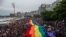 FILE - A giant rainbow flag is pictured during the Gay Pride parade at Copacabana beach in Rio de Janeiro, Brazil, Sept. 30, 2018. 