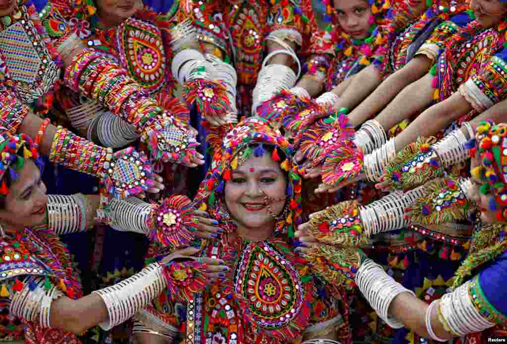 Participants perform during rehearsals for Garba, a folk dance, in preparations for the upcoming Navratri, a festival during which devotees worship the Hindu goddess Durga, in Ahmedabad, India.