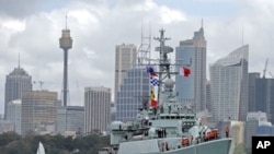 China's People's Liberation Army (PLA) naval frigate 'Mianyang' maneuvres towards the Garden Island naval base in Sydney Harbour, 20 Sep 2010