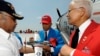 FILE - Tuskegee Airmen Detroit Chapter President Arthur Green, left, holds a P-51 D model plane as Lt. Col. Harry Stewart, Jr., center, and Col. Charles McGee, right sign their autographs June 19, 2012, at Selfridge Air National Guard Base. 