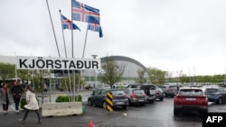 People arrive to vote at a polling station in Reykjavik, Iceland, on June 1, 2024.