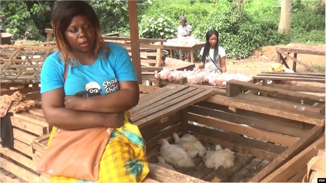 A chicken seller waits for customers in Bertoua, Cameroon, April, 6, 2021. (Moki Edwin Kindzeka/VOA)