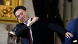 TikTok CEO Shou Chew puts on his coat after the 60th Presidential Inauguration in the Rotunda of the U.S. Capitol in Washington, Jan. 20, 2025.