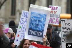 Thousands of demonstrators march in protest of President Donald Trump's visit in Philadelphia, Jan. 26, 2017.