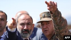 Armenia's acting prime minister, Nikol Pashinyan, speaks with a serviceman in the village of Gegharkunik, near the site where six Armenian servicemen have been captured, May 27, 2021. (Armenian government photo) 