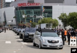 The hearse carrying rapper Nipsey Hussle leaves Staples Center after a memorial service in Los Angeles, April 11, 2019.