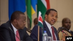 FILE - Tanzanian President Jakaya Kikwete speaks at the extra-ordinary East African Community summit on the Burundi crisis at the State House in Dar es Salaam, Tanzania, May 13, 2015.