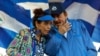 En esta fotografía de archivo del 5 de septiembre de 2018, el presidente de Nicaragua, Daniel Ortega, y su esposa y vicepresidenta Rosario Murillo, encabezan una manifestación en Managua, Nicaragua.