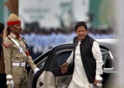 FILE - Pakistani Prime Minister Imran Khan arrives to attend a military parade in Islamabad, Pakistan, March 23, 2019.