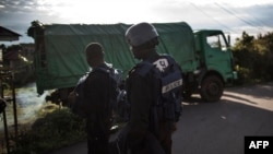 Cameroonian police officers check a truck in Buea on Oct, 7, 2018. Human Rights Watch says police often target sexual minorities for abuse. 