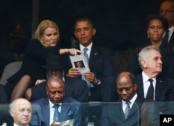 FILE - US President, Barack Obama, attends a memorial service for the late Nelson Mandela, in Soweto, Johannesburg, South Africa, on December 10, 2013.